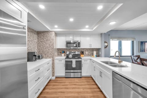 Another kitchen angle highlighting the open layout & easy connection to the living area.