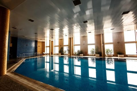 Indoor pool, open 8:00 AM to 8:00 PM, sun loungers, lifeguards on site