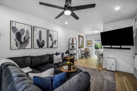 Bright living room with comfortable sectional and 55" TV