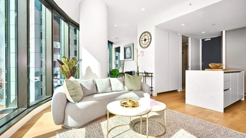 Light-filled living space with floor-to-ceiling windows and modern elegance.