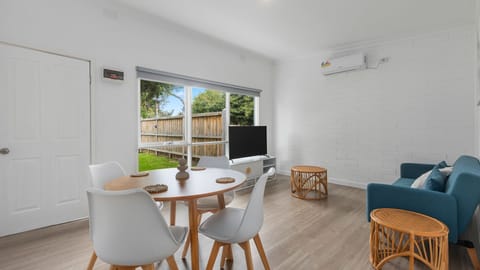 Bright open living and dining area with garden outlook
