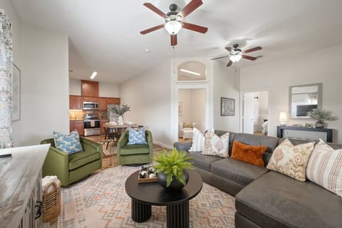 Spacious, bright living room with cozy couches and natural light.