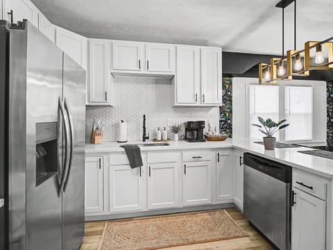 Clean white kitchen w/ stainless appliances & plenty of counter space