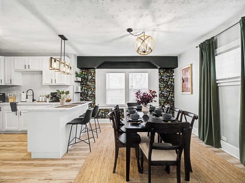 Light-filled dining area beside the kitchen w/ table for shared meals & easy conversation