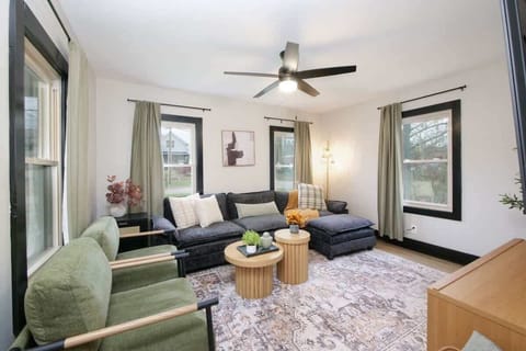 Soft sage greens and warm neutrals create a calming space. A haven for tranquility.