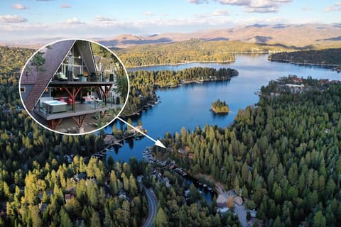 Stunning lakeside A-frame cabin with breathtaking views, nestled in a serene forest setting.