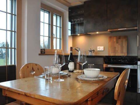 Furniture, Interior Design, Kitchen, Countertop, Flooring, Cabinetry, Wood, Chair, Kitchen Appliance, Ceiling