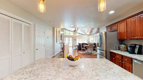 View from kitchen island to living room and lake