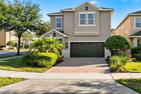 Stunning home with plenty of parking and lush green space.