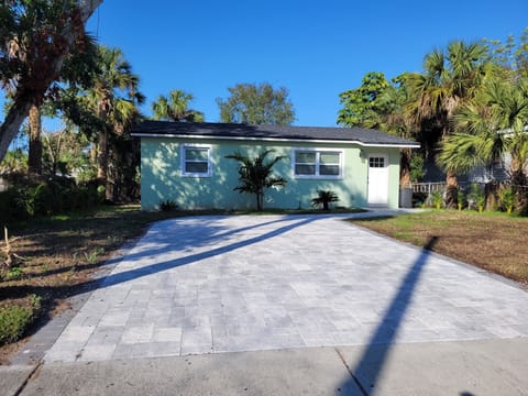House has new large, wide paver driveway