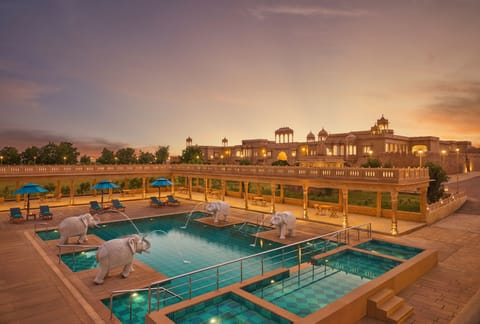 Outdoor pool, open 7:00 AM to 7:00 PM, pool umbrellas, sun loungers