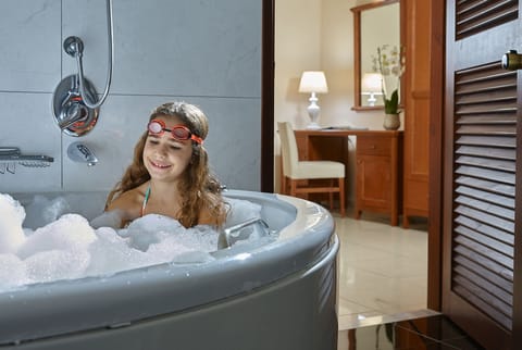 Shower, hair dryer, slippers, towels