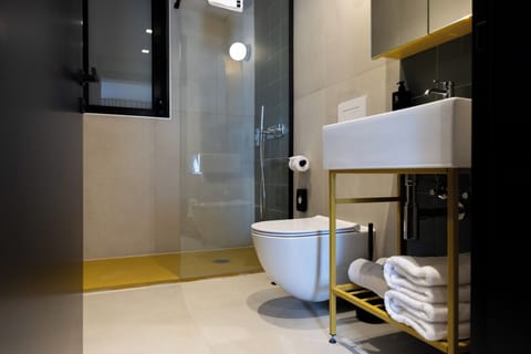 Double Room, Balcony, City View | Bathroom | Shower, bathrobes, slippers, towels