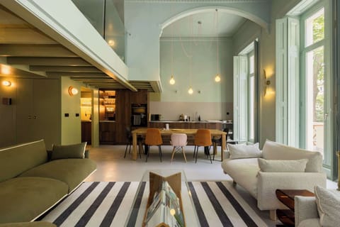 Open-plan kitchen with 10-seater dining table and spacious living room