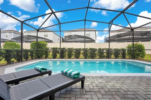 Relax by the private screened pool with comfortable loungers and fresh towels.