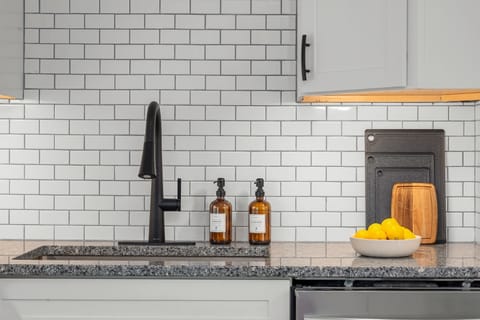 "Thoughtful Details for a Stress-Free Stay" We provide the essentials so you don’t have to pack them. Enjoy premium hand and dish soaps, a deep undermount sink for easy cleanup, and plenty of prep space on our granite countertops.