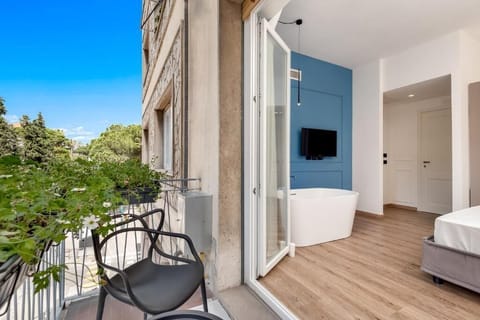 Deluxe Double Room, Balcony | Minibar, desk, blackout drapes, soundproofing