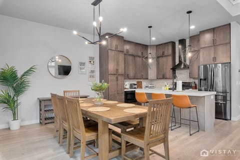 Dining table with seating for eight, perfect for family meals or gathering with friends.