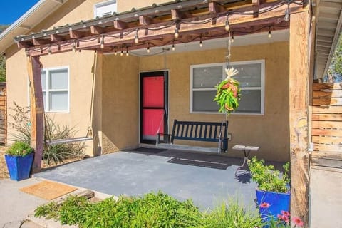 This is your inviting front porch with three porch swings to enjoy each other’s company.