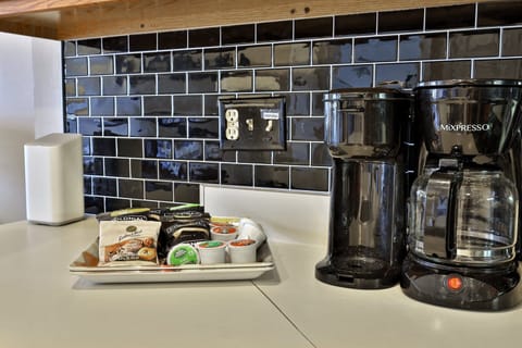 Complete with a full size coffee maker or Kurig. Electric kettle and an assortment of coffee and teas for your enjoyment as well