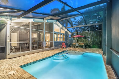 Dive into your private screened-in paradise—this heated pool is all yours.
