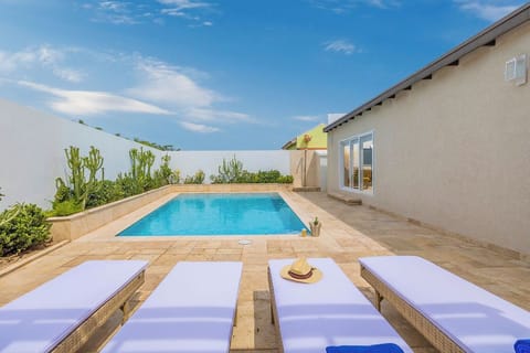 Dive into tranquility with this sparkling private pool, offering the perfect escape for relaxation and leisure.