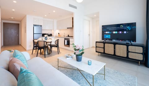 Living room with attached sofa and Ultra Smart TV.