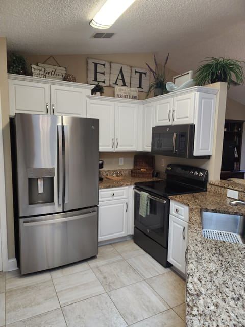 Tile Floors, stainless steel appliances 