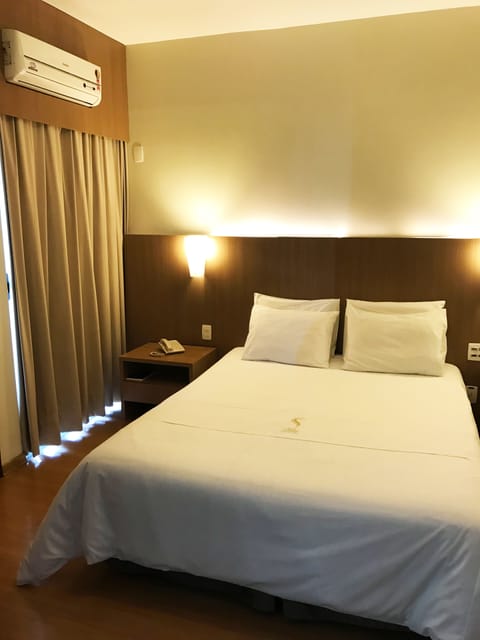 Minibar, desk, blackout drapes, iron/ironing board