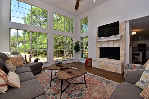 Curl up in the airy living room & enjoy a movie night in style