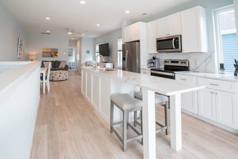 Each Side has Kitchen with Quartz Counters