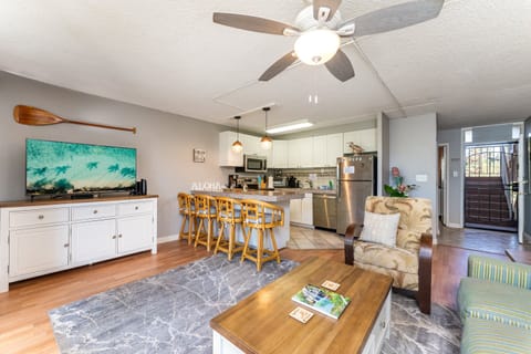 Great Room with window AC, queen sleeper sofa, cable and smart TV, free Wifi, spacious kitchen with dining area and lanai  with small seating area
