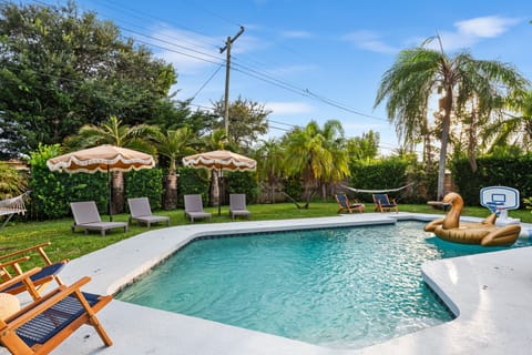 Large pool with inflatables, sun loungers, beach essentials