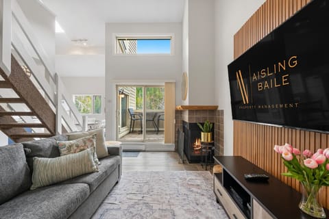 Living room with mountain views, 65` TV with cable, a decorative fireplace, board games & a cozy sectional with a pull-out sleeper sofa (all linens provided.)