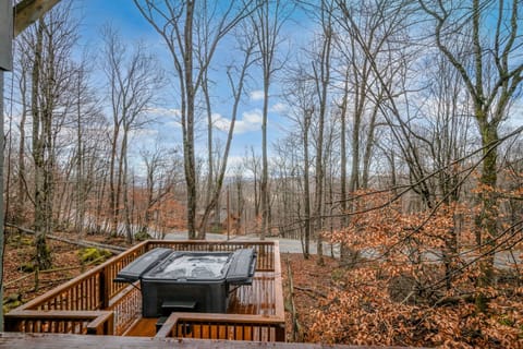 End the day with a quiet soak in the hot tub while taking in the peaceful forest setting.