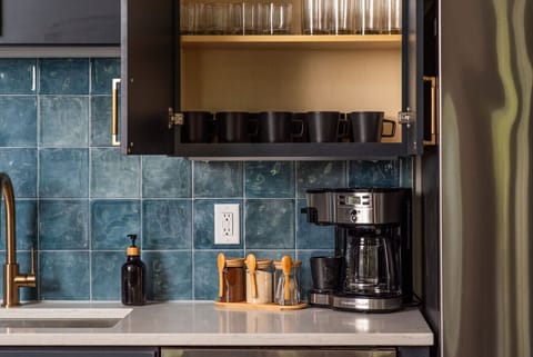 Brew your perfect cup of coffee at the cozy coffee corner, complete with a high-quality machine and an assortment of coffees, teas, and spices to start your day right.