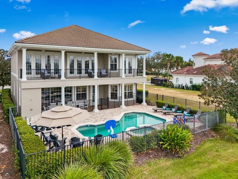 Stunning multi-story vacation home creates a true resort-style arrival.