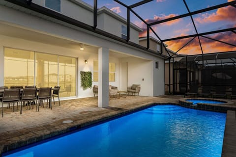 Enjoy lovely evenings outside by the private pool.