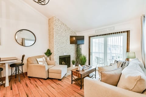 A GREAT PLACE TO RELAX WITH A BEAUTIFUL FIREPLACE AND EXIT TO THE BALCONY