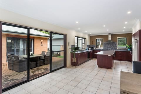 Oversized kitchen leading onto courtyard