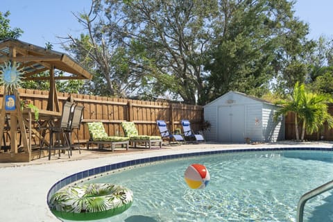 Outdoor Pool Oasis: Pool, Sun Loungers and Poolside Hightop Dining