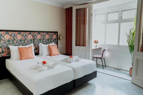 Standard Double or Twin Room, City View | In-room safe, desk, laptop workspace, soundproofing