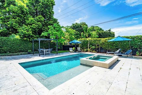 "Unwind in this private Airbnb oasis—sparkling pool, relaxing hot tub, and shaded dining under the pergola."