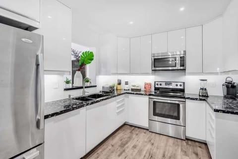 "Whip up something delicious—this Airbnb kitchen shines with stainless steel style and modern ease."