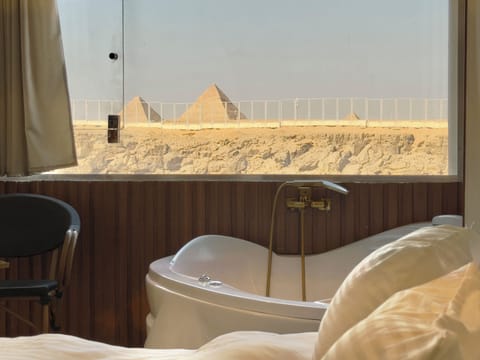 Luxury Jacuzzi Pyramids View Suite | Private spa tub