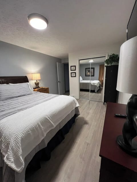 2nd bedroom with new comfortable queen bed with Roku TV and ceiling fan