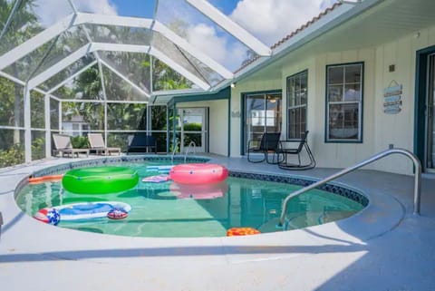Vibrant pool, filled with an array of colorful pool toys and floats