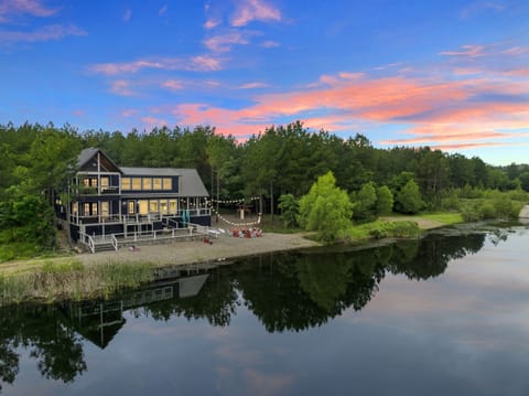 Nestled by a tranquil pond and framed by lush trees, this cabin is your perfect nature escape.