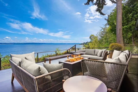 Discover the ultimate outdoor relaxation with our patio, complete with inviting couches and a TV for your entertainment needs. What would you watch first in this inviting setting?