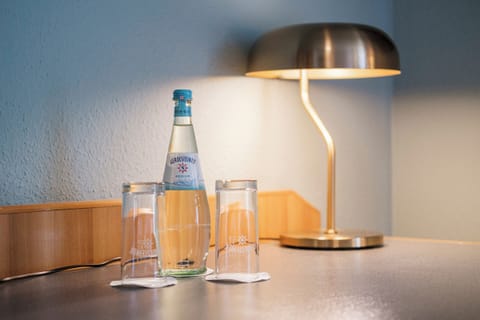 Hypo-allergenic bedding, desk, laptop workspace, blackout drapes